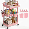 3 Tier Rolling Utility Cart with Drawer, Plastic Storage Organizer Rolling Carts with Wheels Handles Hanging Cups Hooks for Office, Bathroom, Kitchen,Craft Art Room (Pink) by LLMRR